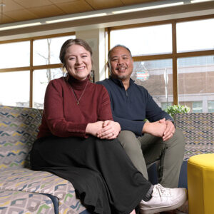 Rachel and Bobby sitting on couch